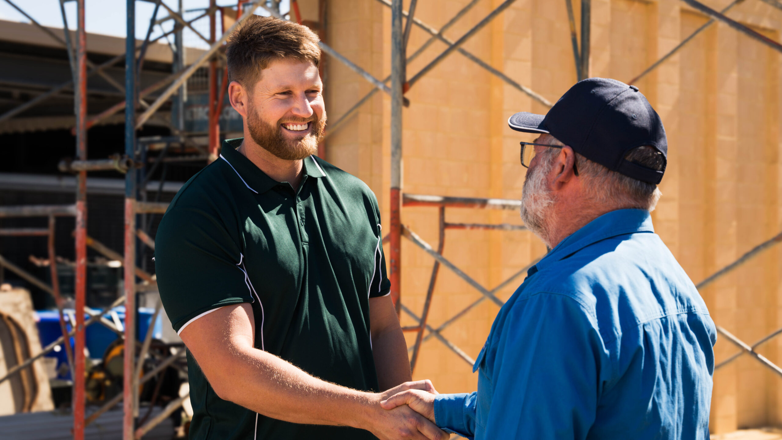 Kyle director of True Living Homes WA with a happy home owner in front of a new house in Perth WA
